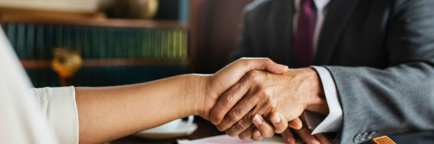 Close up of people shaking hands